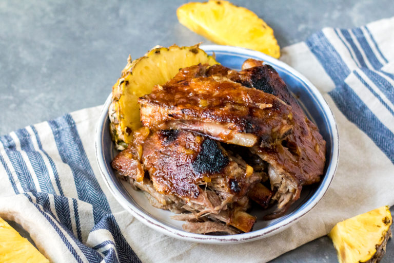 Slow Cooker Pineapple BBQ Ribs cook right in the slow cooker so no need to heat up the kitchen. Full of sweet pineapple flavor, these tender ribs are great!