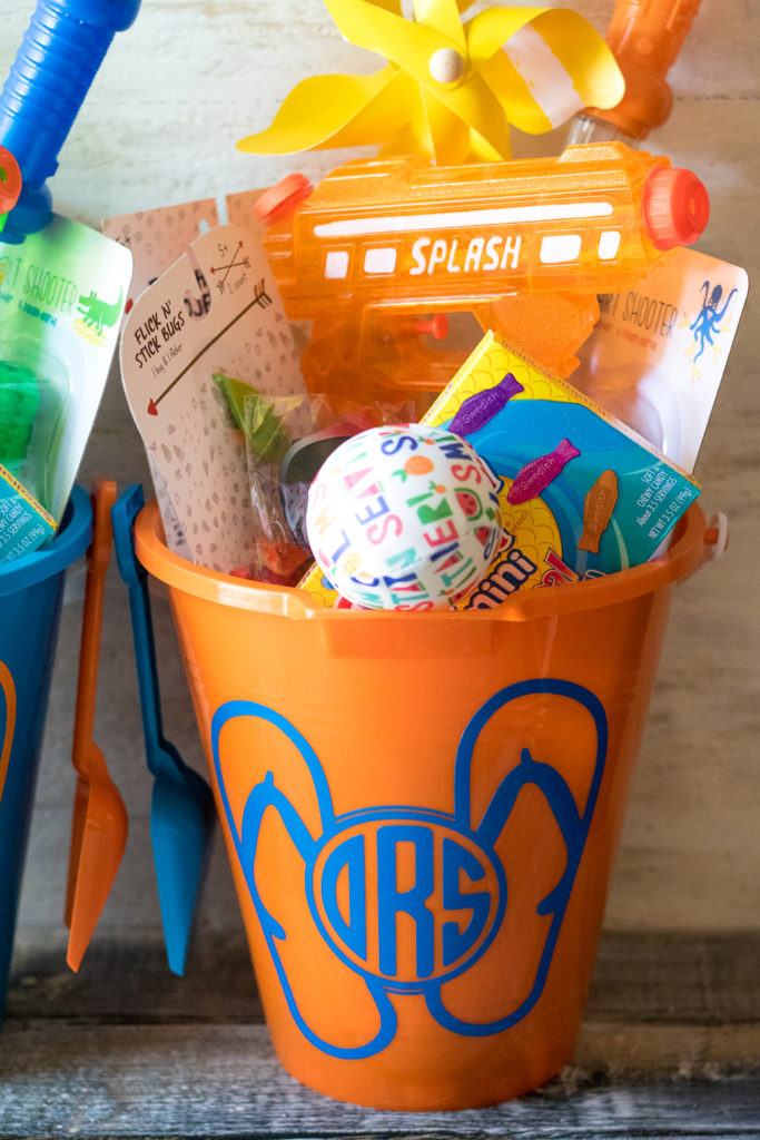 Super fun inexpensive buckets full of goodies for the summer! Perfect for the last day of school or the first day of summer!