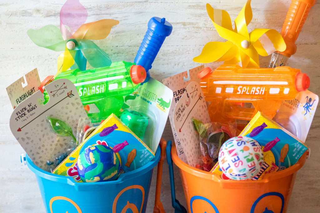 Super fun inexpensive buckets full of goodies for the summer! Perfect for the last day of school or the first day of summer!