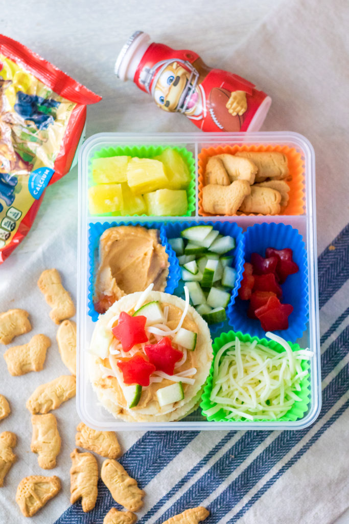 DIY Mediterranean Pizza Lunch Box is a fun and delicious lunch your kids can make themselves! Perfect for back to school and a change from sandwiches!