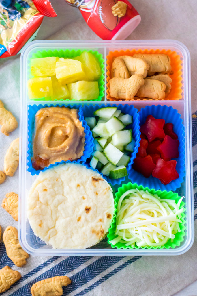 DIY Mediterranean Pizza Lunch Box is a fun and delicious lunch your kids can make themselves! Perfect for back to school and a change from sandwiches!