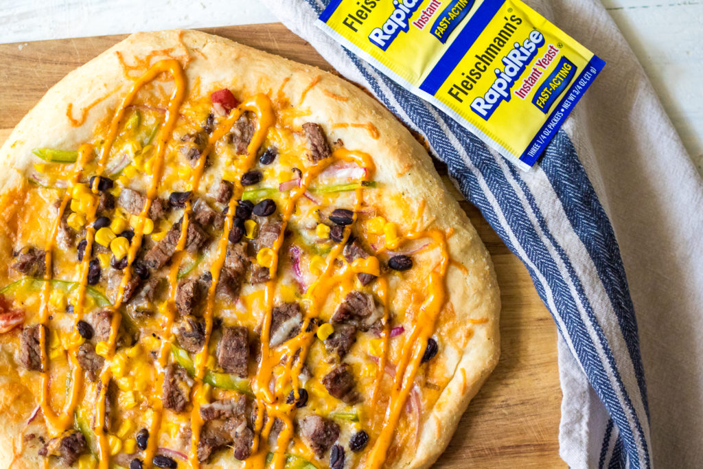 Steak Fajita Pizza will be your new favorite! Homemade crust topped with steak, corn, black beans and peppers and onions make the BEST pizza!