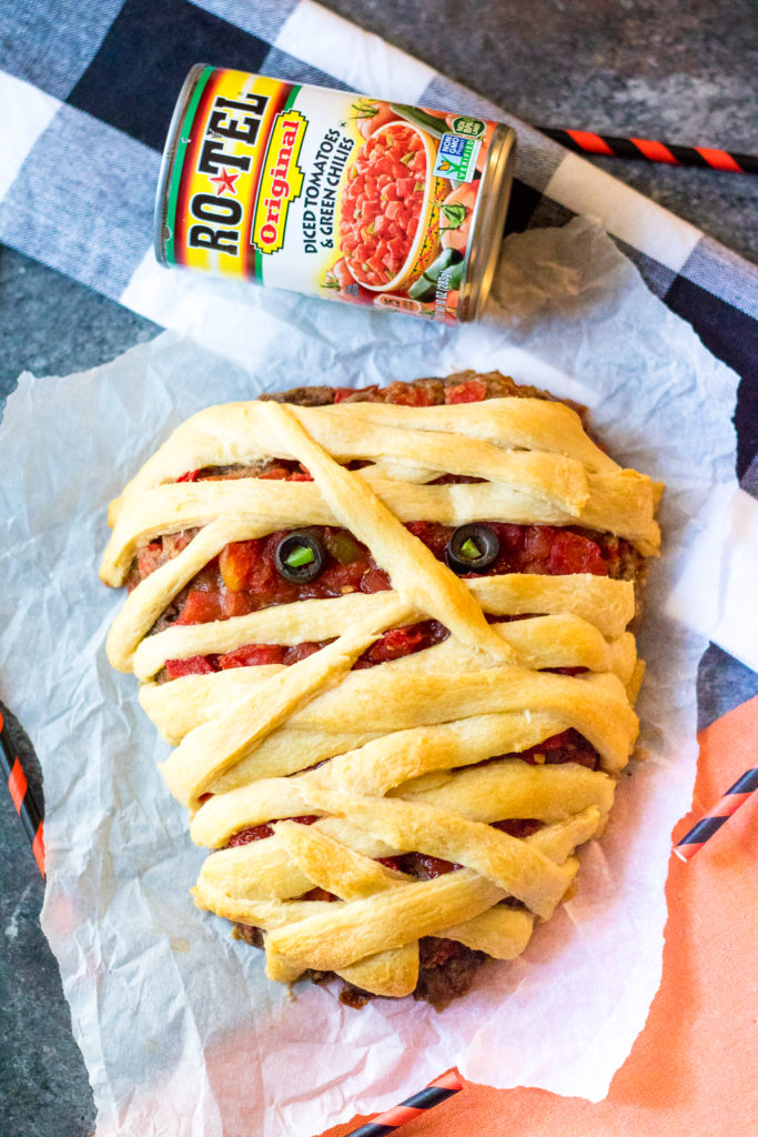 Mummy Meatloaf is a spooky and delicious Halloween dinner your little ghouls and goblins will love! Flavorful meatloaf wrapped in crescent mummy strips yum!