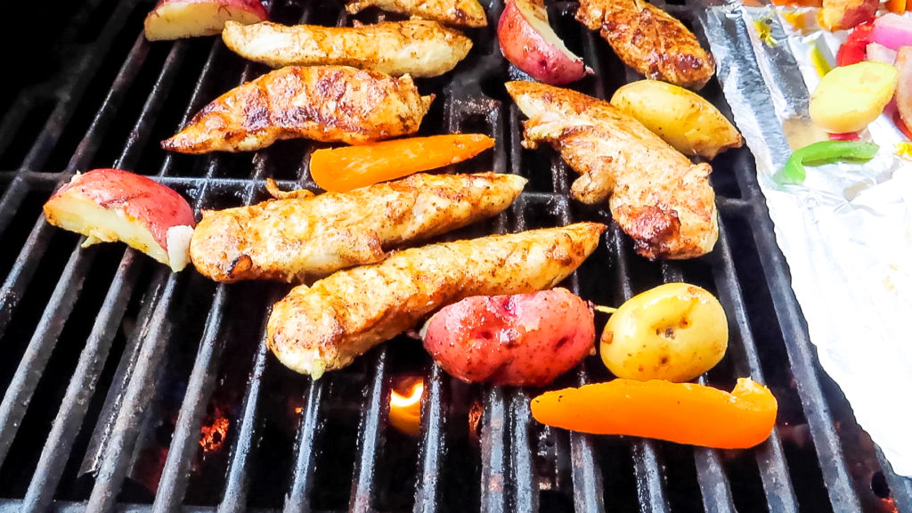 Chicken Fajita Hash is my new favorite thing to grill! Tender marinated chicken on top of grilled potatoes and veggies, yum!
