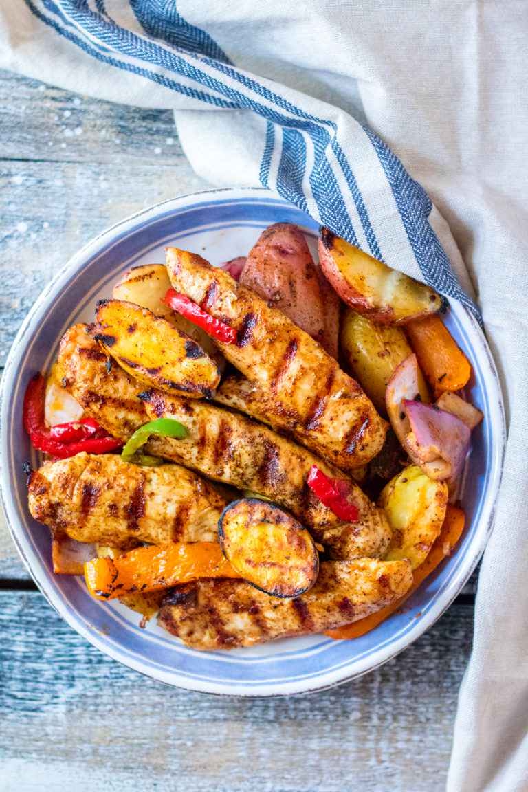 Chicken Fajita Hash is my new favorite thing to grill! Tender marinated chicken on top of grilled potatoes and veggies, yum!