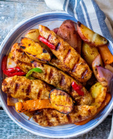 Chicken Fajita Hash is my new favorite thing to grill! Tender marinated chicken on top of grilled potatoes and veggies, yum!