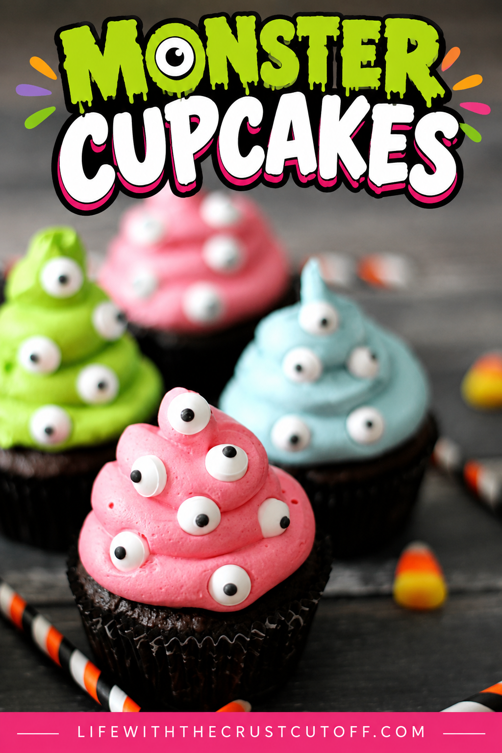 Colorful Monster Cupcakes with pink, green, and blue buttercream frosting decorated with candy eyes for Halloween.