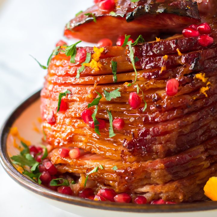 Orange juice, brown sugar, honey and cinnamon make up a deliciousOrange zest, pomegranate seeds and parsley give this ham it’s festive colors.