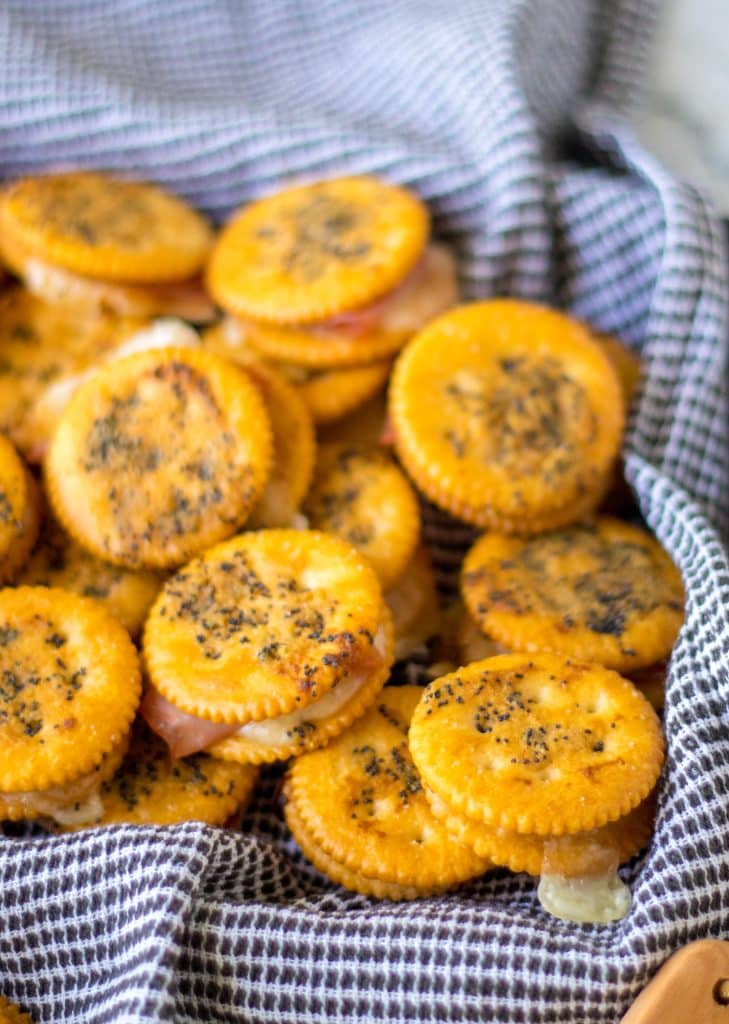 Ritz Cracker Sandwiches piled in a tray.