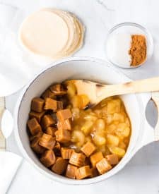 Apples and caramel in pot not melted yet