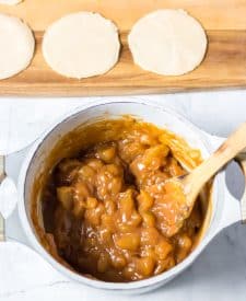 Apples and caramel melted together in pot