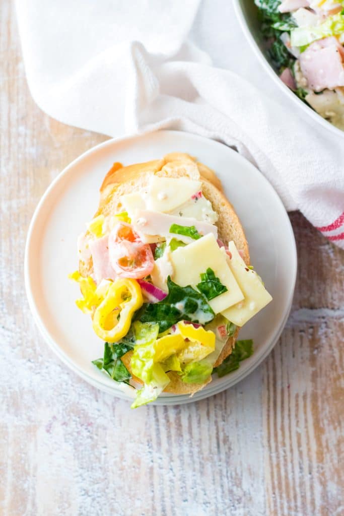 Hoagie dip on a slice on bread on a little white plate