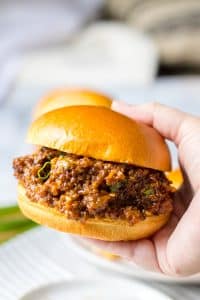Close up of Slow Cooker Korean Sloppy Joes on shiny bun