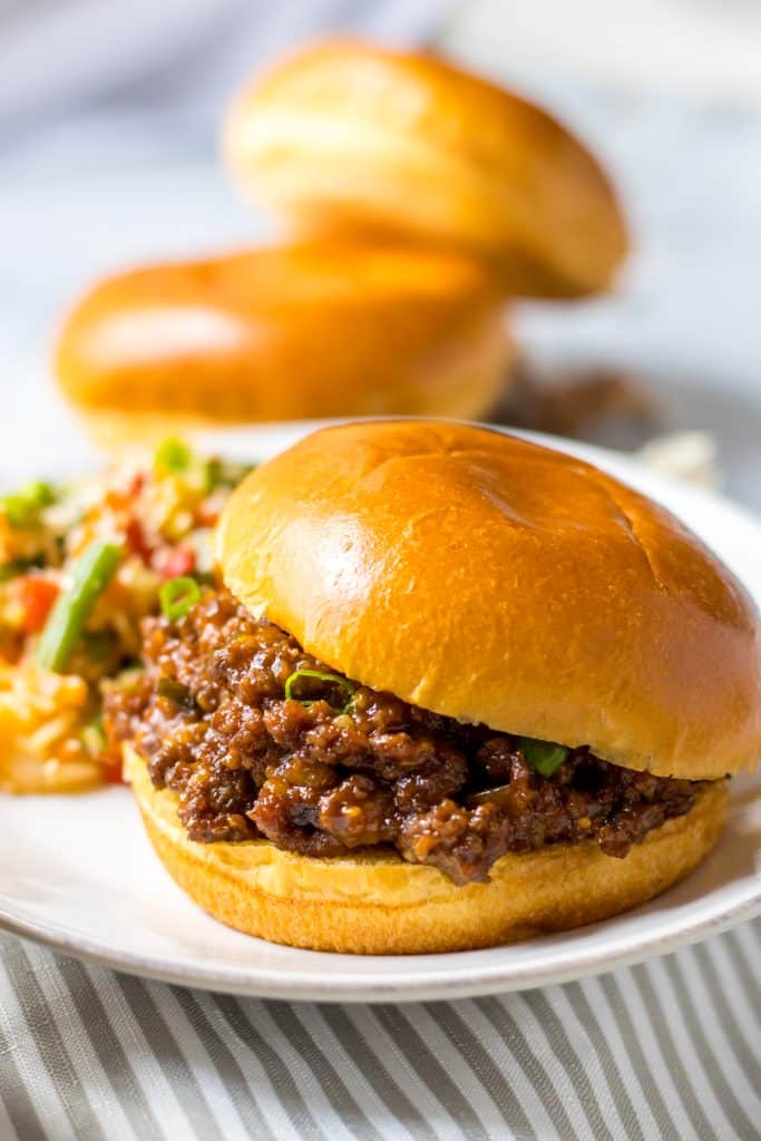 Close up of Slow Cooker Korean Sloppy Joes on shiny bun 