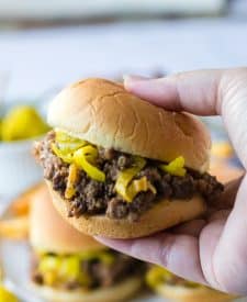 Slow Cooker Mississippi Sloppy Joes in a slider bun being held