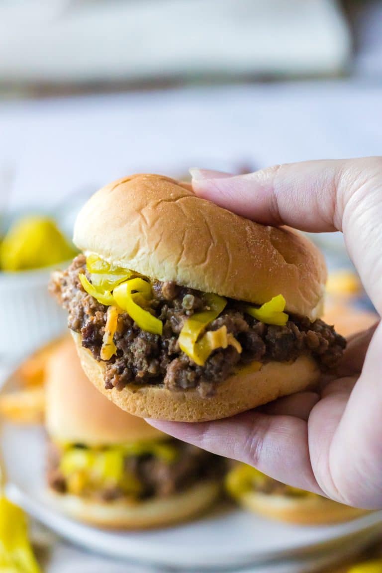 Slow Cooker Mississippi Sloppy Joes in a slider bun being held