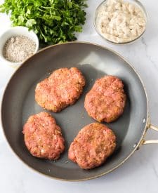 Slow Cooker Smothered Hamburgers raw in frying pan