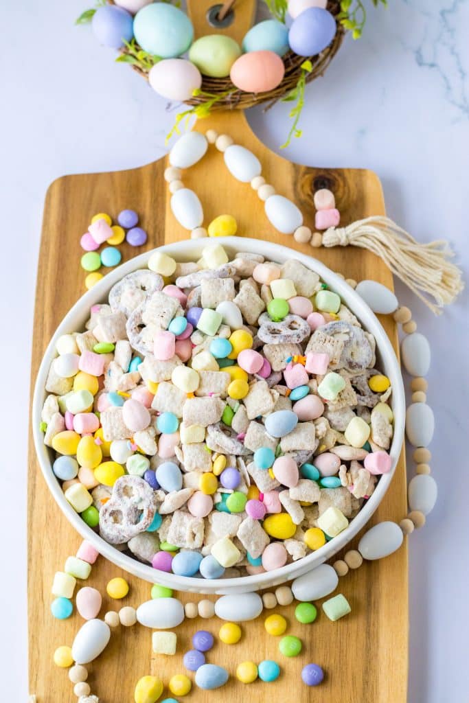 Large white bowl of Bunny Munch on wooden board