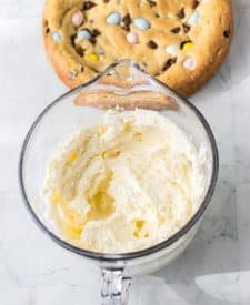 Easter Cookie Cake frosting all mixed up in a bowl
