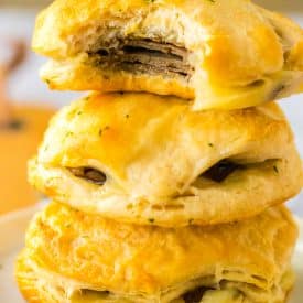 French Dip Biscuits stacked up with a bite taken out of one