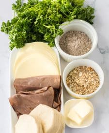 French Dip Biscuits ingredient shot, provolone, roast beef, biscuits, onion soup mix, au jus mix, parsley, butter