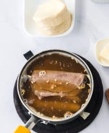 Roast beef warming in onion soup