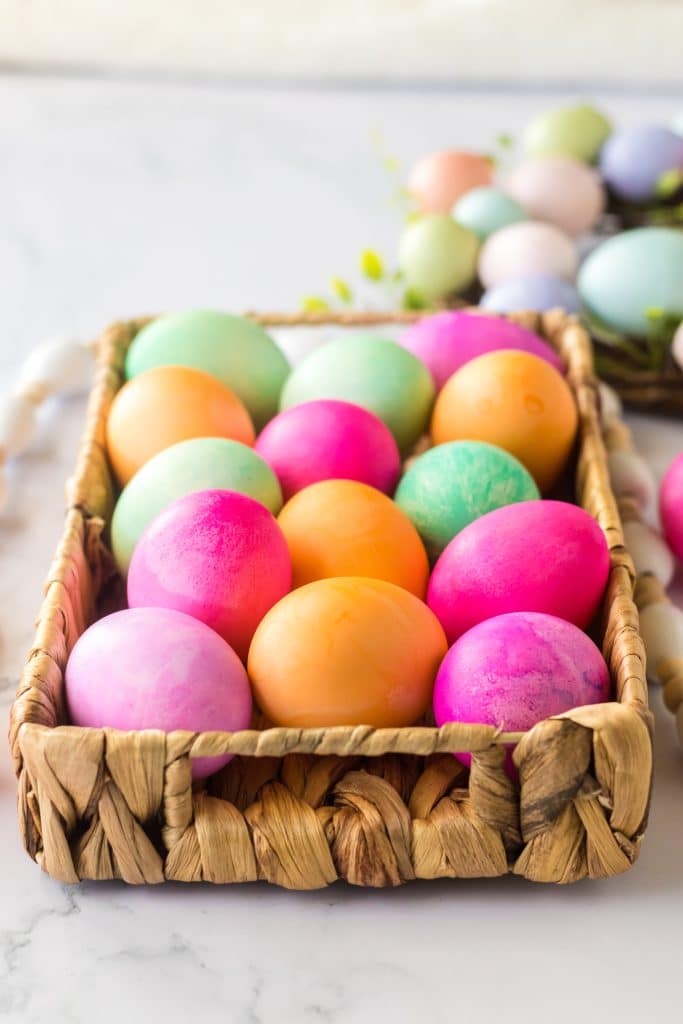 Brightly colored Slow Cooker Dyed Easter Eggs in a basket