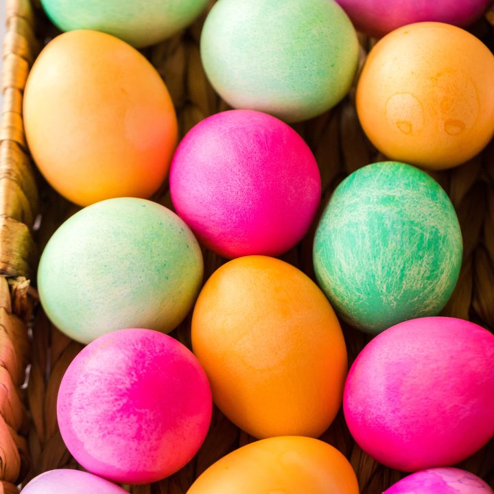 Brightly colored Slow Cooker Dyed Easter Eggs in a basket