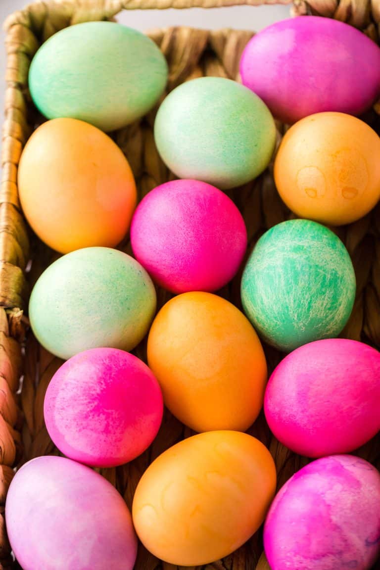 Brightly colored Slow Cooker Dyed Easter Eggs in a basket