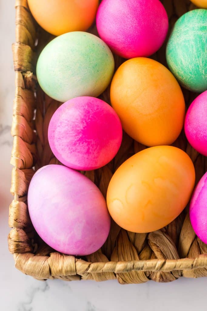 Brightly colored Slow Cooker Dyed Easter Eggs in a basket