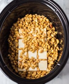 Peanuts and almond bark in slow cooker
