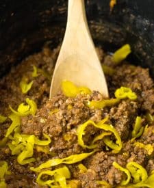 Slow Cooker Mississippi Sloppy Joes cooked in slow cooker with spoon
