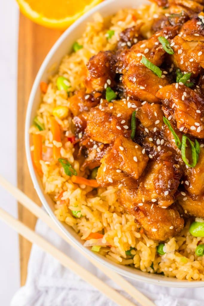 Slow Cooker Orange Chicken piled in a white bowl