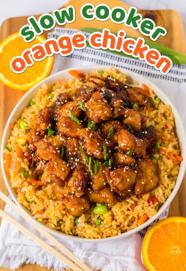 Slow Cooker Orange Chicken piled high in a white bowl