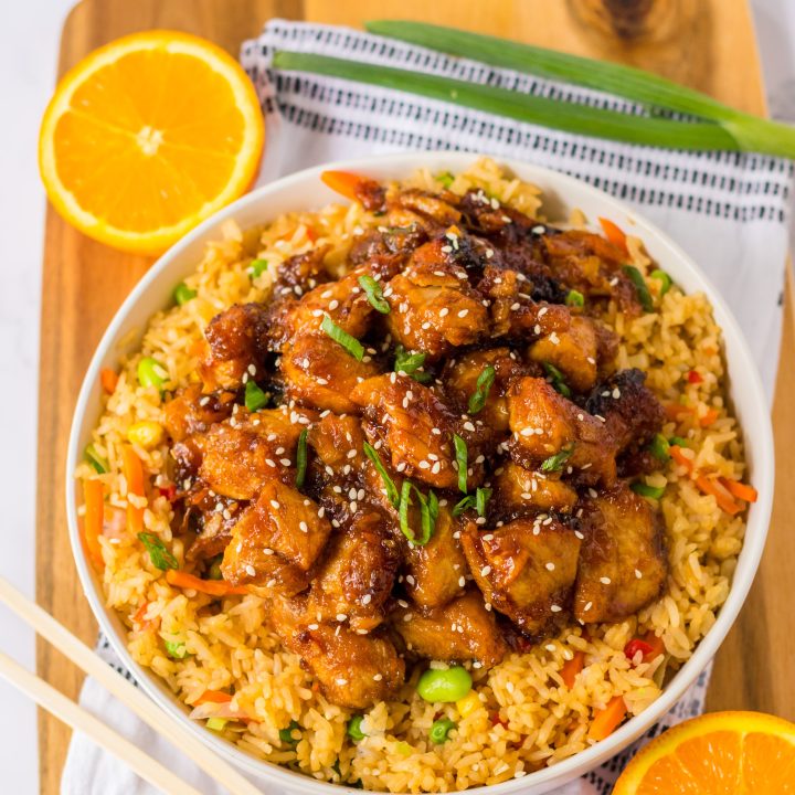 Slow Cooker Orange Chicken piled in a white bowl