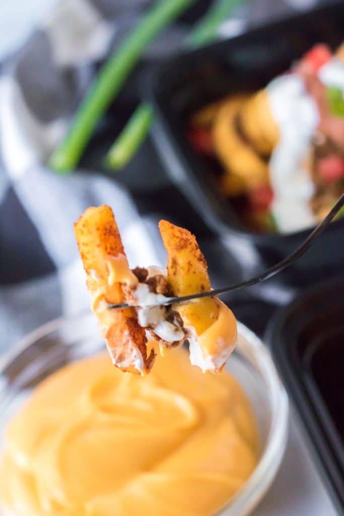 Copycat Taco Bell Nacho Supreme Fries on a fork