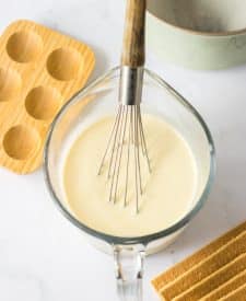 Key Lime Icebox Cake ingredients in bowl with whisk