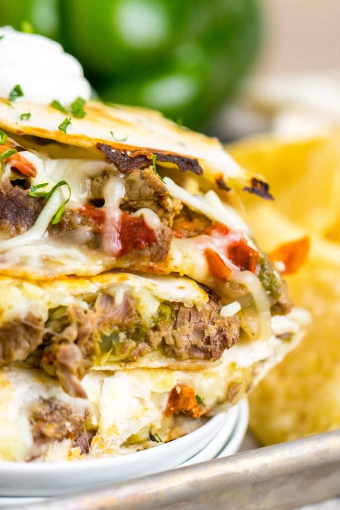 Slow Cooker Cheesesteak Quesadillas stacked on plate