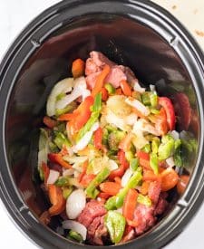 Slow Cooker Cheesesteak Quesadillas ingredients in slow cooker