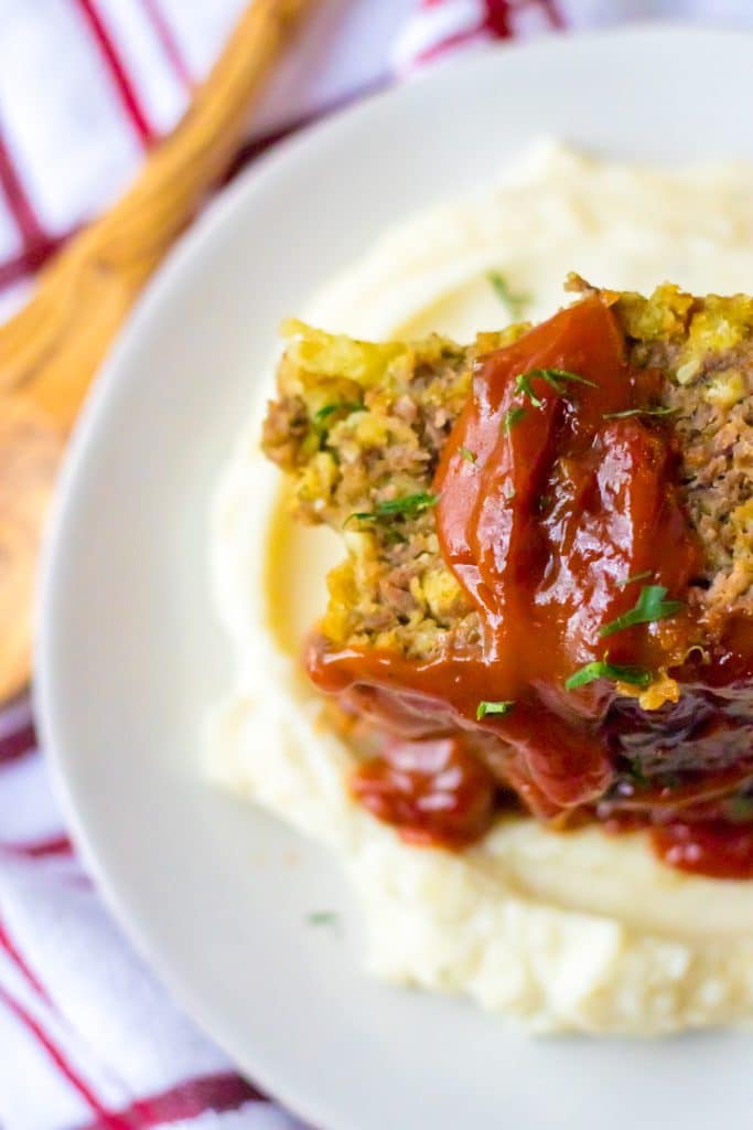 Slow Cooker Easy Meatloaf piled on plate