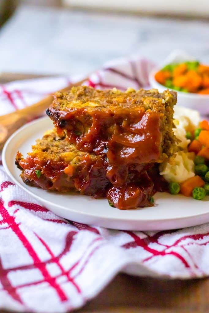 Slow Cooker Easy Meatloaf piled on plate