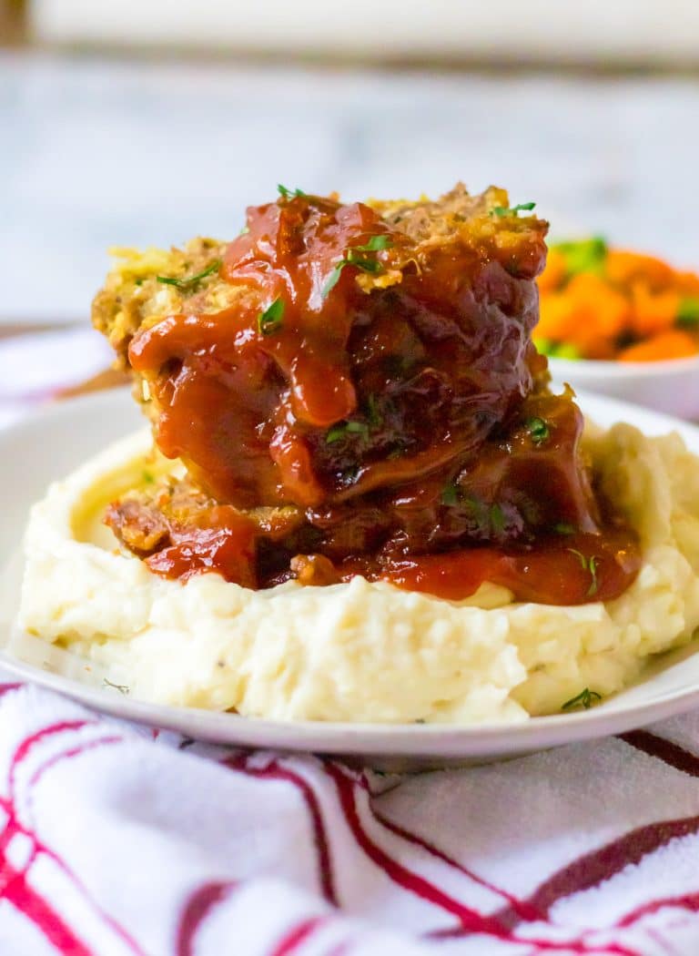 Slow Cooker Easy Meatloaf piled on plate