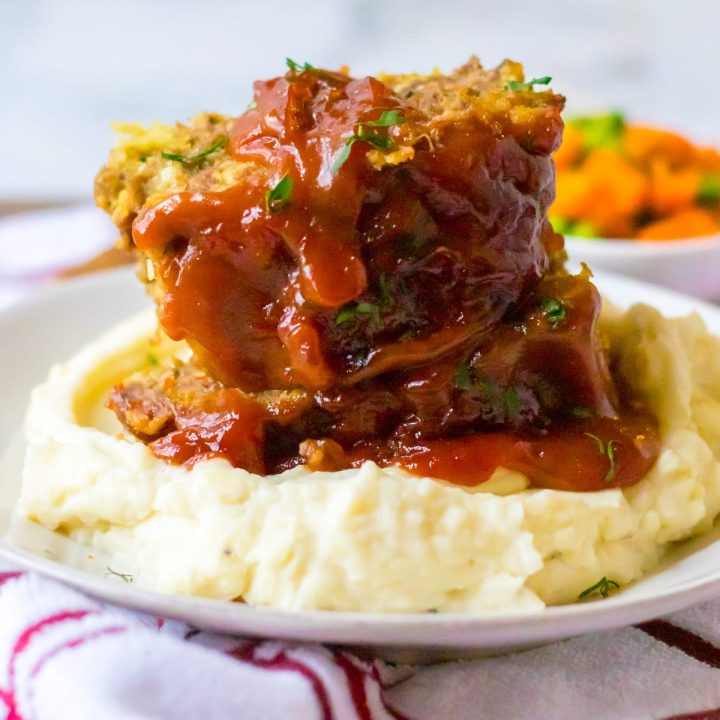 Slow Cooker Easy Meatloaf piled on plate