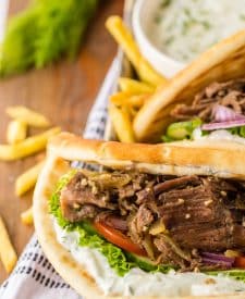 Close up of Slow Cooker Gyros in a tray with fries