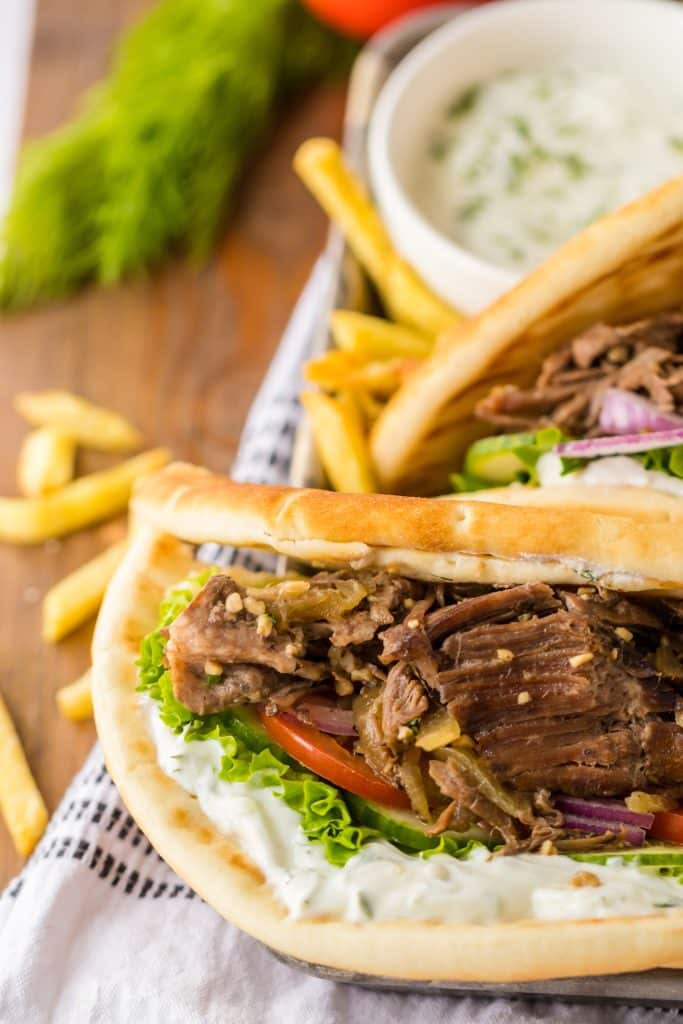 Close up of Slow Cooker Gyros in a tray with fries