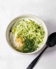 Tzatziki sauce ingredients in bowl