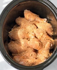 Slow Cooker Honey BBQ Drumsticks seasoned in a slow cooker