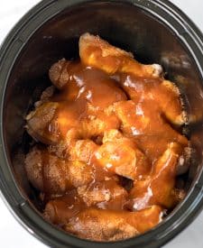 Slow Cooker Honey BBQ Drumsticks with sauce in slow cooker