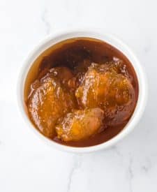 Slow Cooker Honey Peach Country Ribs sauce in a bowl