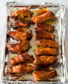 Slow Cooker Honey Peach Country Ribs on a sheet pan
